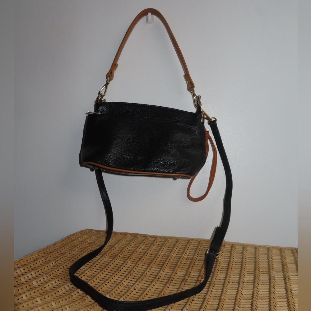 Black and brown everyday purse with 3 zippered pockets and 3 handle options
